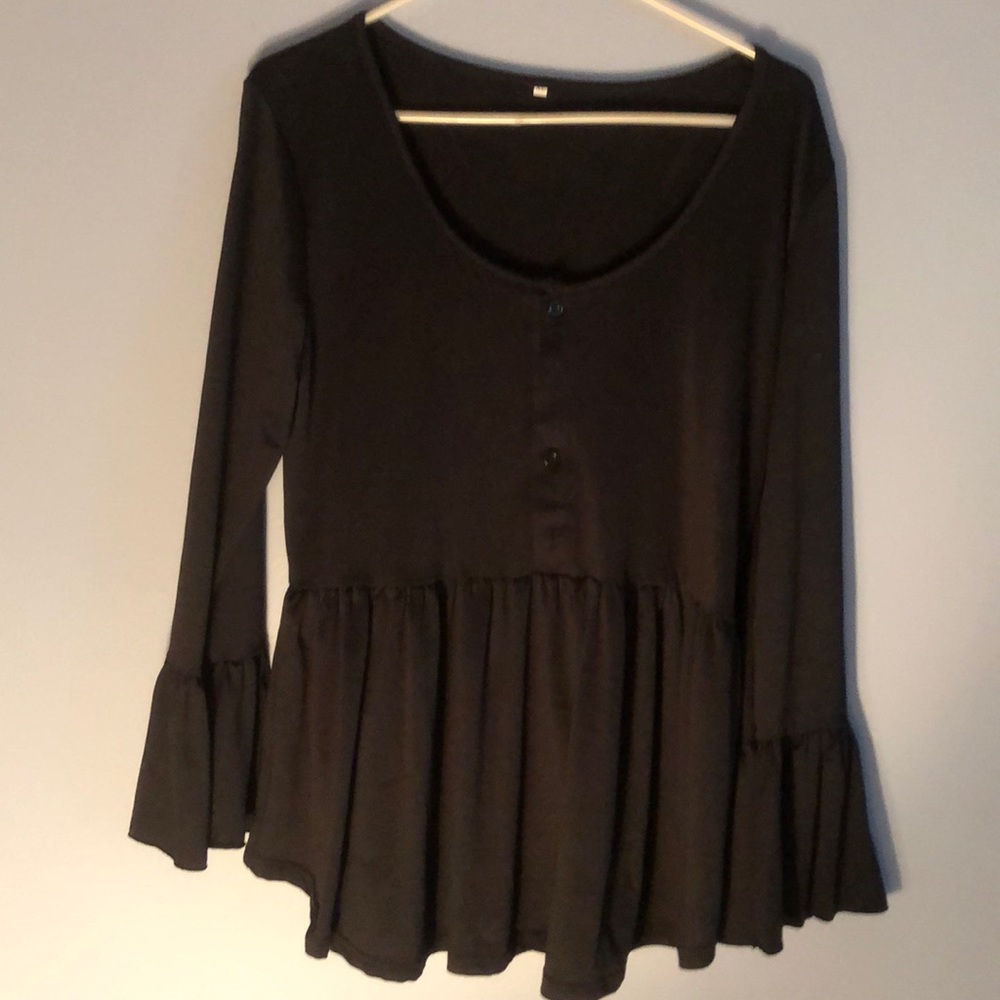 Black shirt with long ruffled sleeves